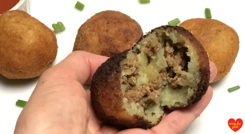 Meat Stuffed Cassava Ball cut in half.