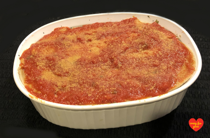 CrazyForYuca.com - a "real food" gluten and dairy-free recipe blog and place for all things yuca / cassava. Unbaked Cassava Flour Pasta Lasagna ready to go into the oven. In white Corningware baking dish.