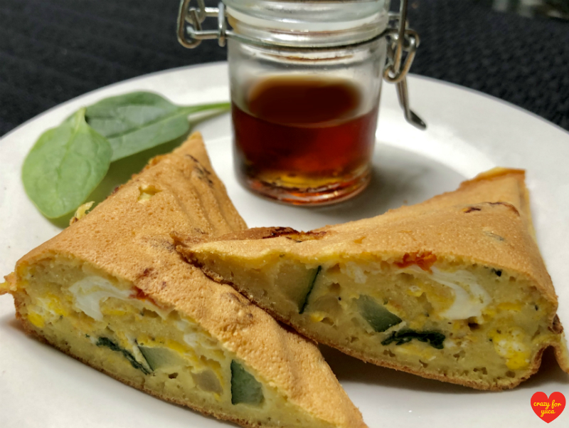 Grain-Free Pancake Pocket sliced in half with maple syrup. CrazyForYuca.com